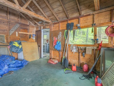 Set along approximately 150 feet of pristine shoreline on the - photo 23