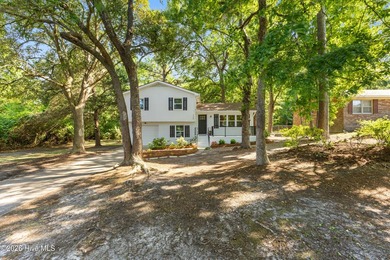 Nestled beneath a beautiful canopy of mature trees in a - photo 3