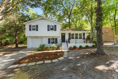 Nestled beneath a beautiful canopy of mature trees in a - photo 4