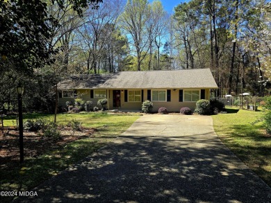 This charming 4-bedroom, 3-bathroom home is located in the - Lake Home For Sale in Macon, Georgia