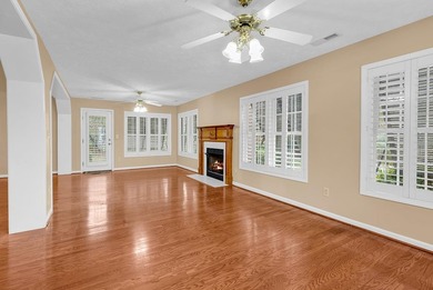 Nestled beneath mature oaks, this custom all-brick home offers a - photo 11