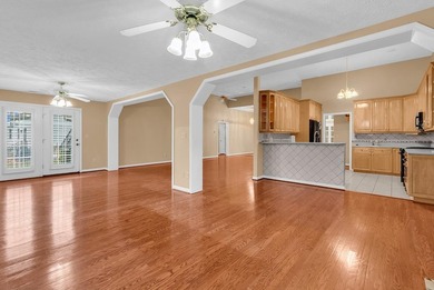 Nestled beneath mature oaks, this custom all-brick home offers a - photo 13