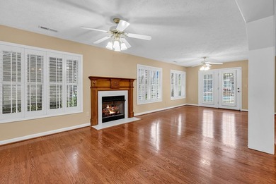 Nestled beneath mature oaks, this custom all-brick home offers a - photo 15