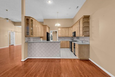 Nestled beneath mature oaks, this custom all-brick home offers a - photo 16