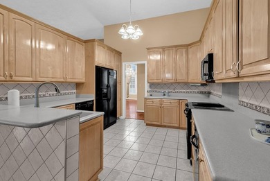 Nestled beneath mature oaks, this custom all-brick home offers a - photo 18