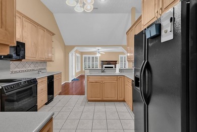 Nestled beneath mature oaks, this custom all-brick home offers a - photo 19