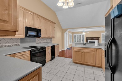 Nestled beneath mature oaks, this custom all-brick home offers a - photo 20
