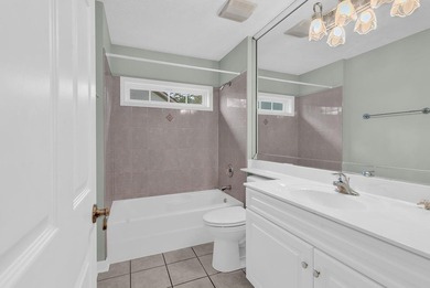 Nestled beneath mature oaks, this custom all-brick home offers a - photo 30