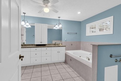 Nestled beneath mature oaks, this custom all-brick home offers a - photo 36