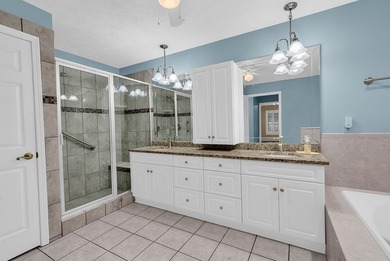 Nestled beneath mature oaks, this custom all-brick home offers a - photo 38