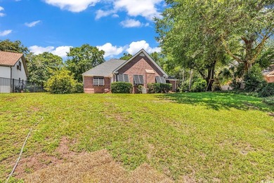Nestled beneath mature oaks, this custom all-brick home offers a - photo 51