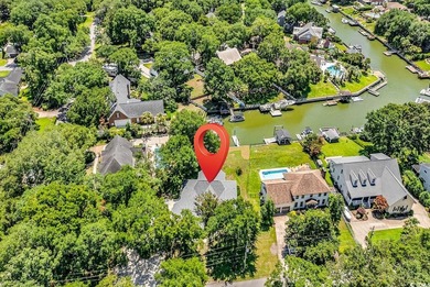 Nestled beneath mature oaks, this custom all-brick home offers a - photo 52