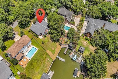 Nestled beneath mature oaks, this custom all-brick home offers a - photo 54