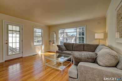 This gorgeous, sun-splashed end-unit townhouse-originally the