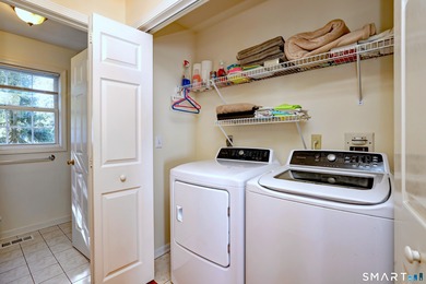 This gorgeous, sun-splashed end-unit townhouse-originally the