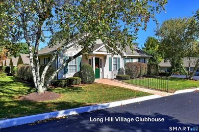 This gorgeous, sun-splashed end-unit townhouse-originally the