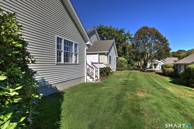 This gorgeous, sun-splashed end-unit townhouse-originally the