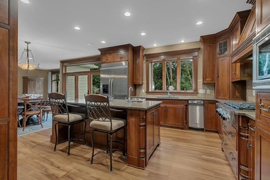 Tucked away on over two wooded acres in Sartell, this stunning - photo 11