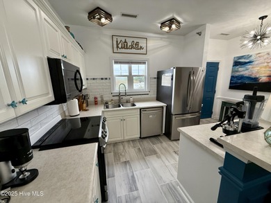 Welcome to this beautifully updated top-floor 2-bedroom, 2-bath