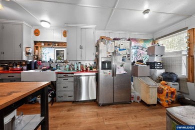 Coastal cottage full of character and opportunity. Wood siding