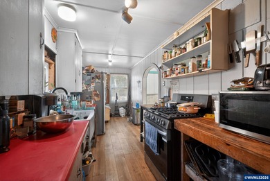 Coastal cottage full of character and opportunity. Wood siding