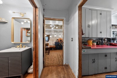 Coastal cottage full of character and opportunity. Wood siding