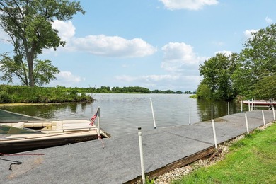 Discover an unparalleled Chain of Lakes lakefront retreat, with - photo 2