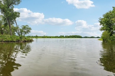 Discover an unparalleled Chain of Lakes lakefront retreat, with - photo 3