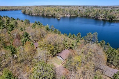 Nestled on a wooded lot on beautiful 204 AC BOOTH lake, this - photo 11