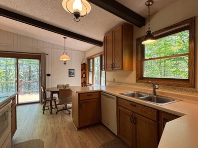 Nestled on a wooded lot on beautiful 204 AC BOOTH lake, this - photo 16