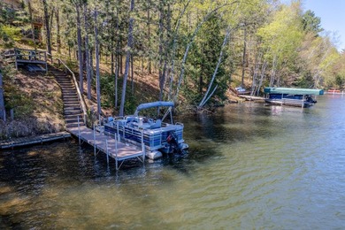 Nestled on a wooded lot on beautiful 204 AC BOOTH lake, this - photo 37