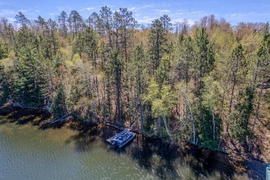 Nestled on a wooded lot on beautiful 204 AC BOOTH lake, this - photo 38