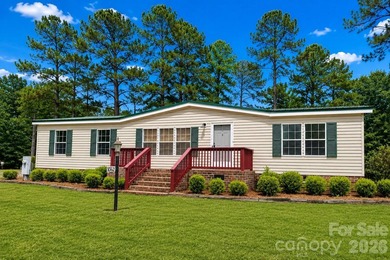 Nestled on a breathtaking 1.29-acre lakefront lot, this - photo 2