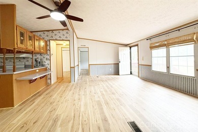 Nestled on a breathtaking 1.29-acre lakefront lot, this - photo 4