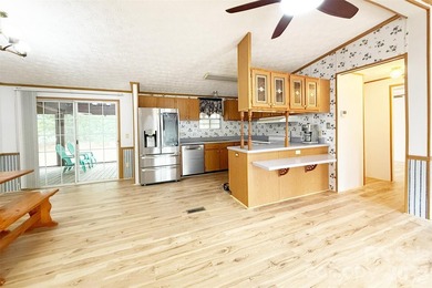 Nestled on a breathtaking 1.29-acre lakefront lot, this - photo 5