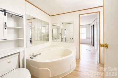Nestled on a breathtaking 1.29-acre lakefront lot, this - photo 7
