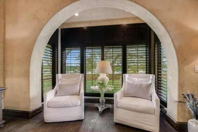 A front courtyard fireplace sets the tone, where the glow of the - photo 21