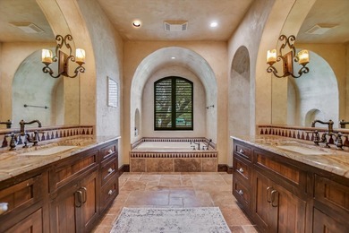 A front courtyard fireplace sets the tone, where the glow of the - photo 23