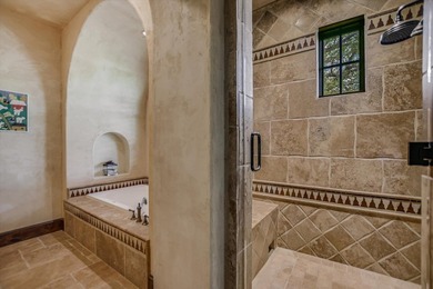 A front courtyard fireplace sets the tone, where the glow of the - photo 24