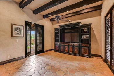 A front courtyard fireplace sets the tone, where the glow of the - photo 27