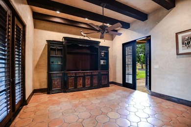 A front courtyard fireplace sets the tone, where the glow of the - photo 28