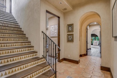 A front courtyard fireplace sets the tone, where the glow of the - photo 32