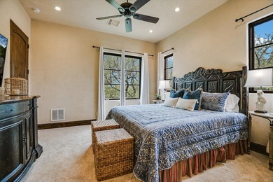 A front courtyard fireplace sets the tone, where the glow of the - photo 34