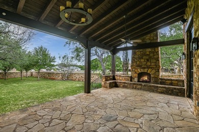 A front courtyard fireplace sets the tone, where the glow of the - photo 38