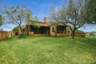 A front courtyard fireplace sets the tone, where the glow of the - photo 39