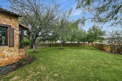 A front courtyard fireplace sets the tone, where the glow of the - photo 40