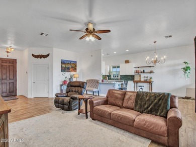 Set on a fully fenced acre beneath wide-open desert skies, this