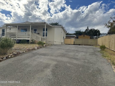 Charming 3-bedroom home on a spacious lot in Mayer! Enjoy the