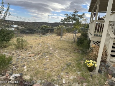 Charming 3-bedroom home on a spacious lot in Mayer! Enjoy the