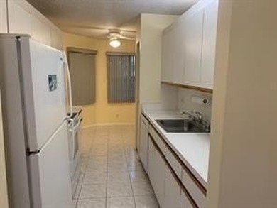 Come see this 2-bedroom, 2-bathroom condo in Century Village - photo 14